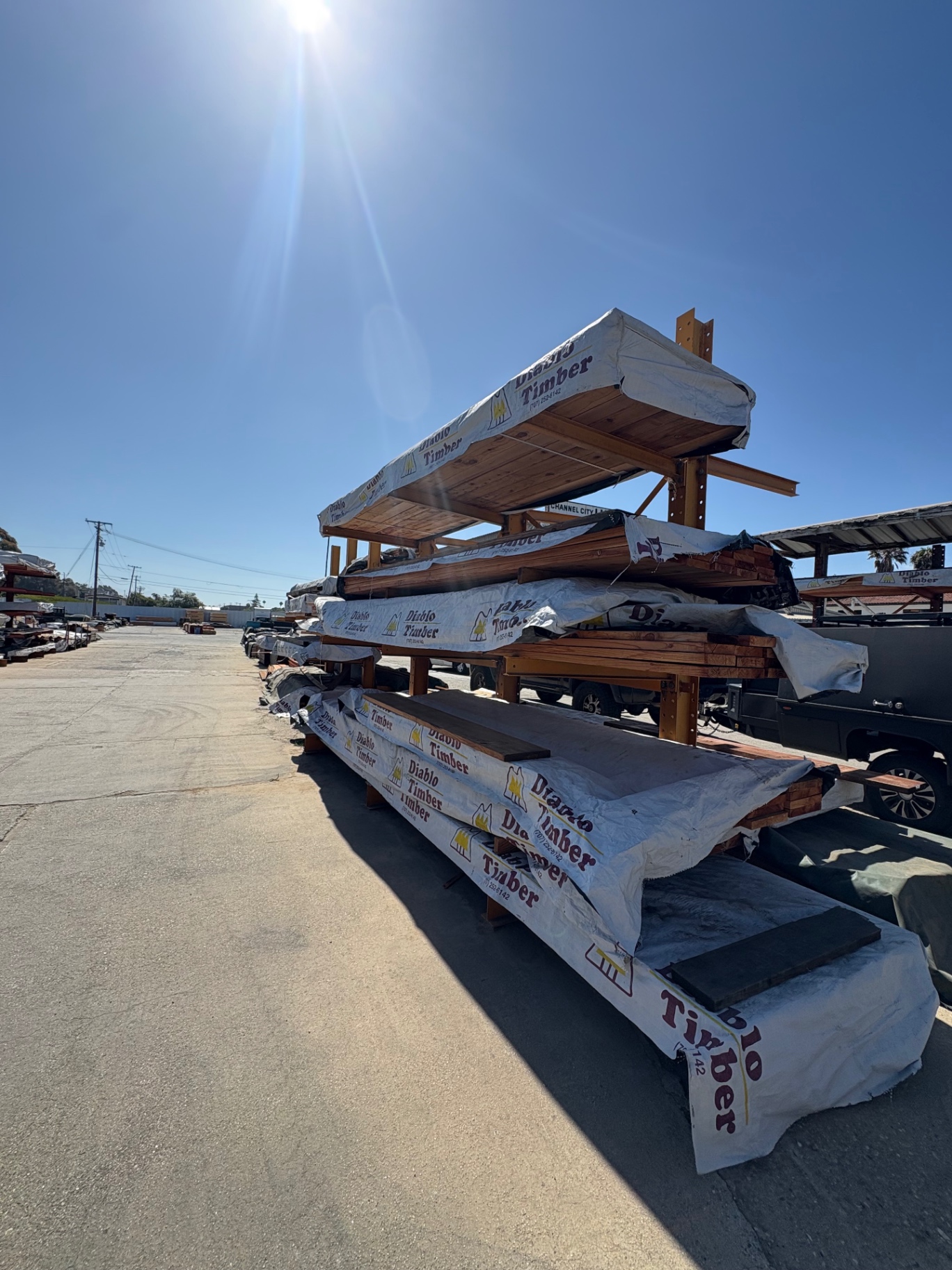 Lumber yard racks stacked with Diablo Timber redwood