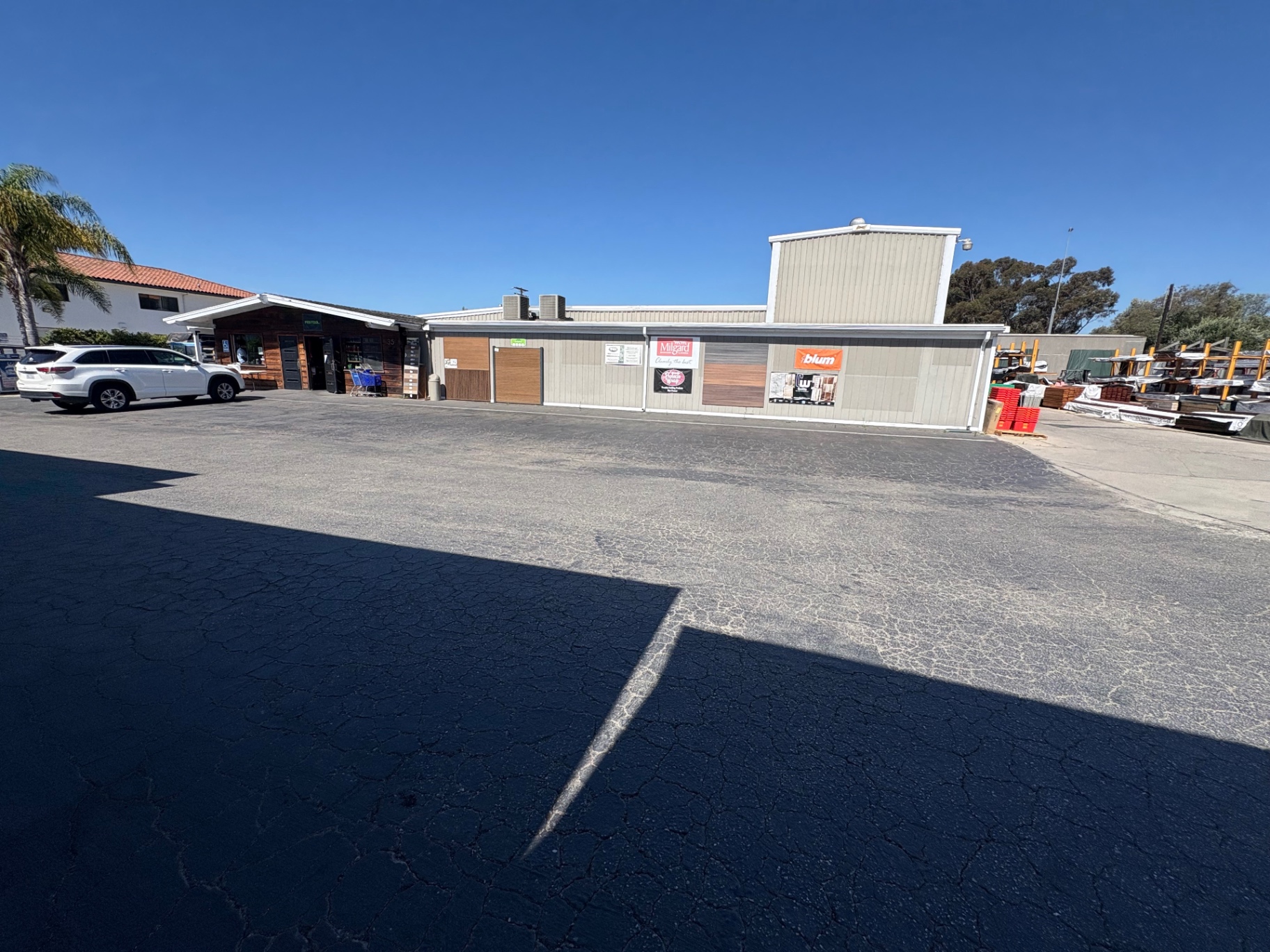 Channel City Lumber storefront in Goleta with Milgard and Blum signage